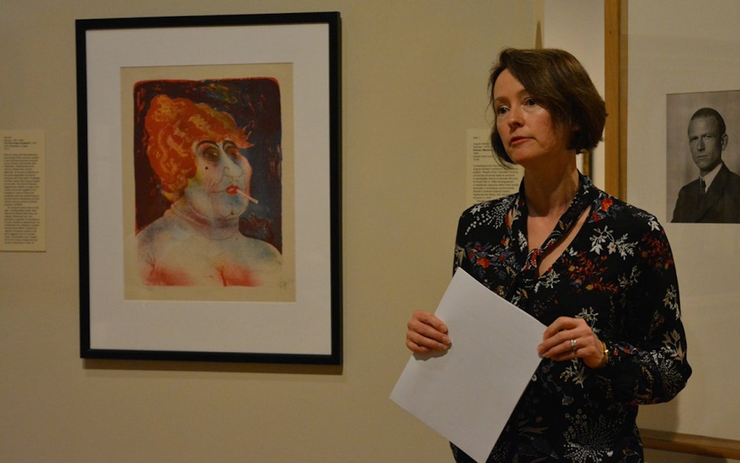 Julia Roos addresses an audience question next to a lithograph done by artist Otto Dix. This event took place Wednesday afternoon in the Eskenazi Museum of Art.