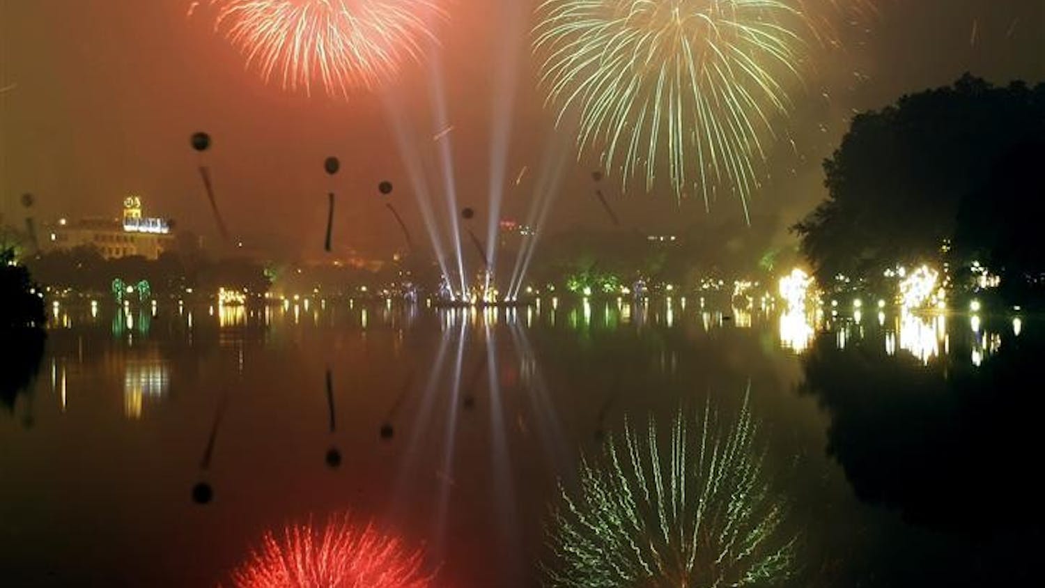 Fireworks are launched above Hoan Kiem Lake Monday in Hanoi, Vietnam, Monday for the Lunar New Year celebrations.