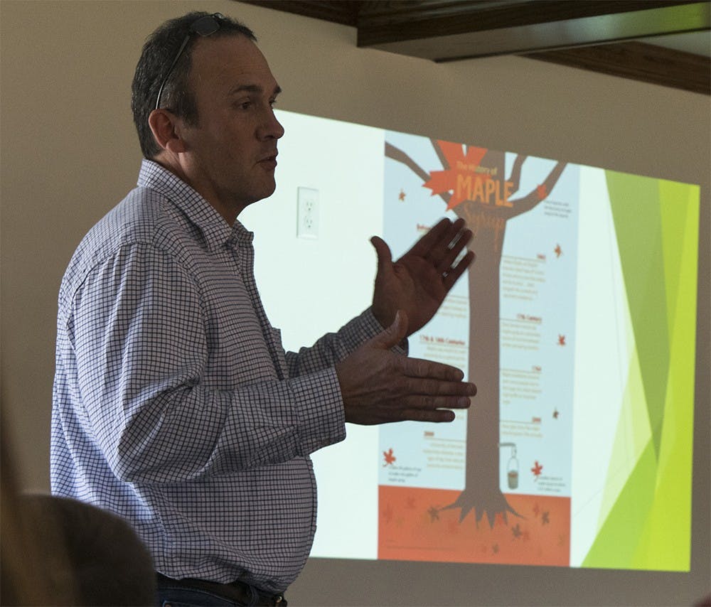 Mike Smith talks about maple sugar production during the National Maple Syrup Festival Saturday at Creekside Retreat in Brown County. 
