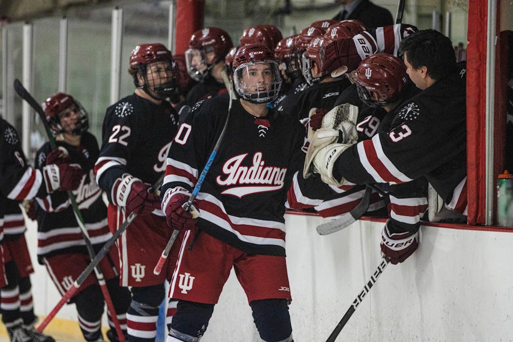 <p>The IU club hockey team high-fives between periods during a match against Bowling Green State University Oct. 14, 2022, at the Frank Southern Ice Arena. Indiana beat NC State and Virginia Tech before falling to North Carolina at the ACC Inviational on Oct. 21-23 in Vinton, Virginia. </p>
