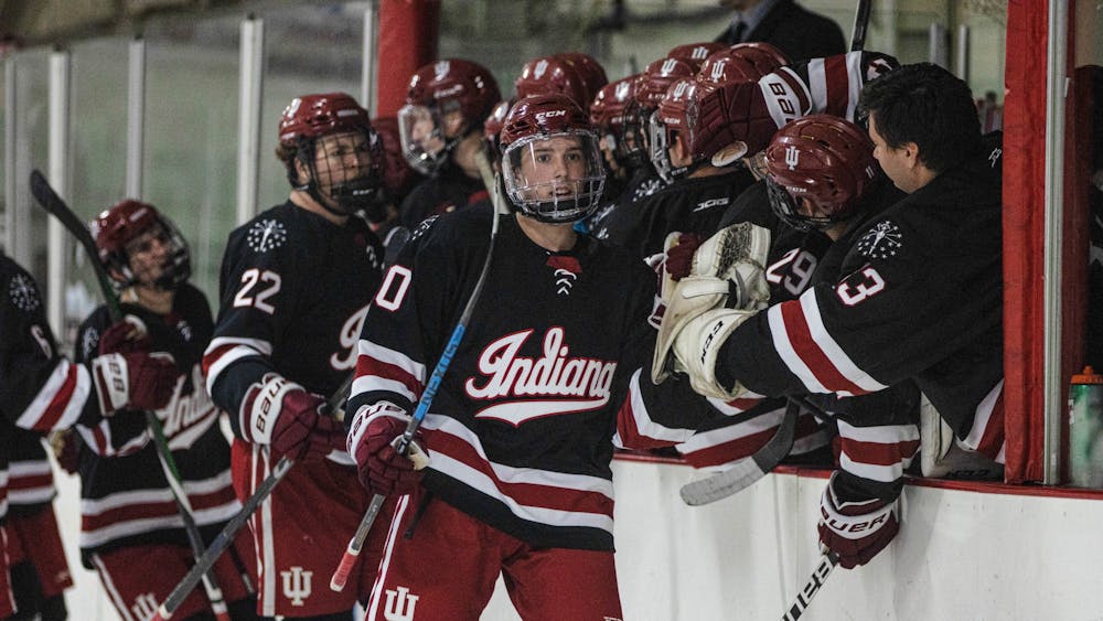The IU club hockey team high-fives between periods during a match against Bowling Green State University Oct. 14, 2022, at the Frank Southern Ice Arena. Indiana beat NC State and Virginia Tech before falling to North Carolina at the ACC Inviational on Oct. 21-23 in Vinton, Virginia. 