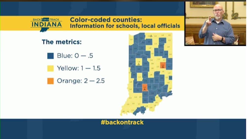 A screen displaying an Indiana map with Monroe and Delaware counties shaded orange is shown during a Zoom meeting Wednesday with Gov. Eric Holcomb. Orange counties have moderate to high community spread of COVID-19. 