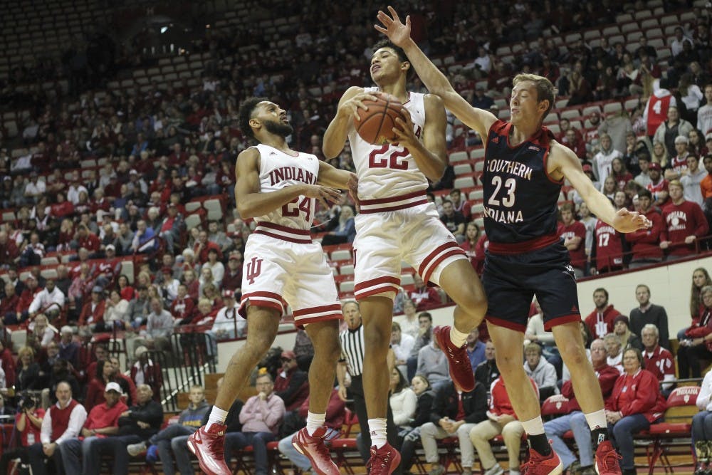 Sophomore forward Clifton Moore grabs the ball away from University of Southern Indiana freshman Glen Rouch on Nov. 1 in Simon Skjodt Assembly Hall. IU defeated USI, 96-62.&nbsp;