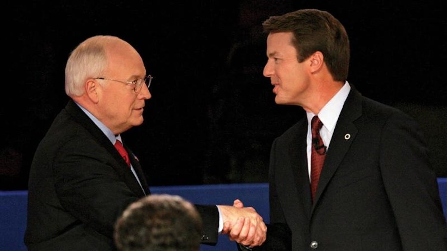 Vice President Dick Cheney and Democratic vice presidential candidate John Edwards shake hands before their vice presidential debate at Case Western Reserve University on Oct. 5, 2004 in Cleveland on Tuesday. In the foreground is moderator Gwen Ifill.