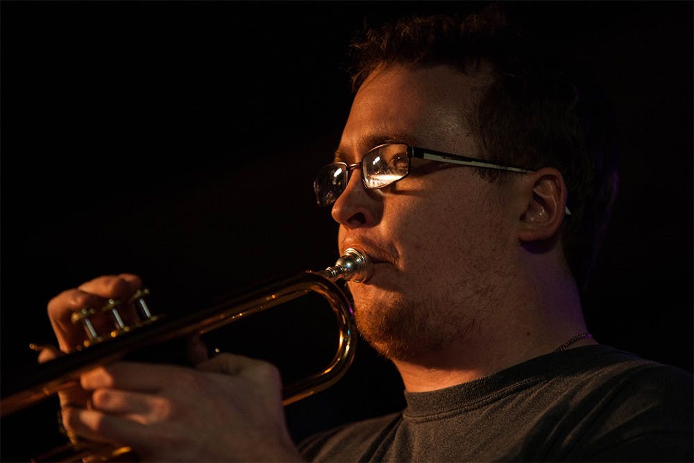 Trumpet player Joe Anderson plays a solo during JKS’s record release show. JKS played at the Player’s Pub on Sunday. 