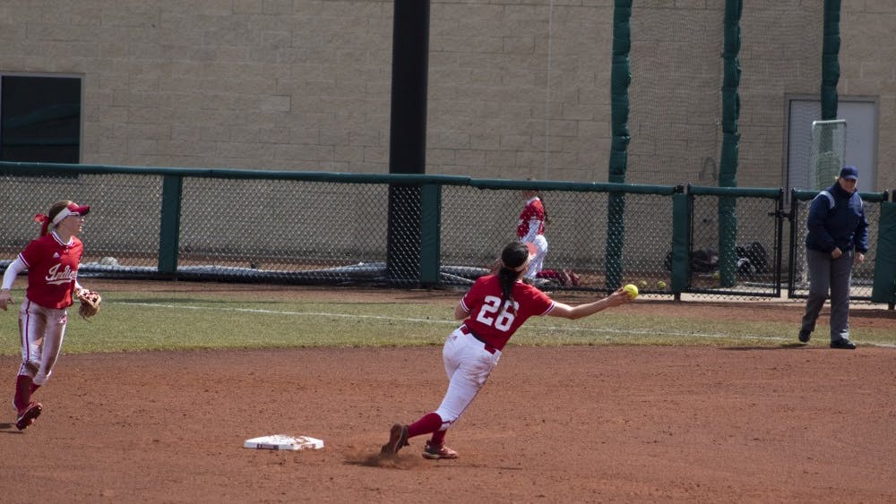 Sophomore infielder Grayson Radcliffe throws to first March 17 during the IU softball game against Ohio University. IU won the game 6-4.