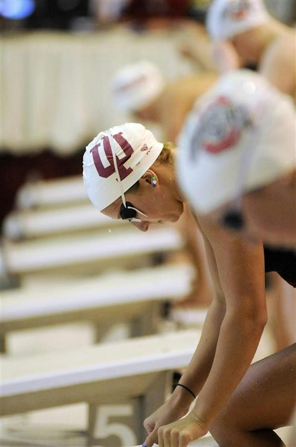 IU senior Allison Kay takes a moment before climbing onto the starting block for a butterfly heat during a double dual against Ohio State and Missouri on Saturday at the Counsilman-Billingsley Aquatic Center.