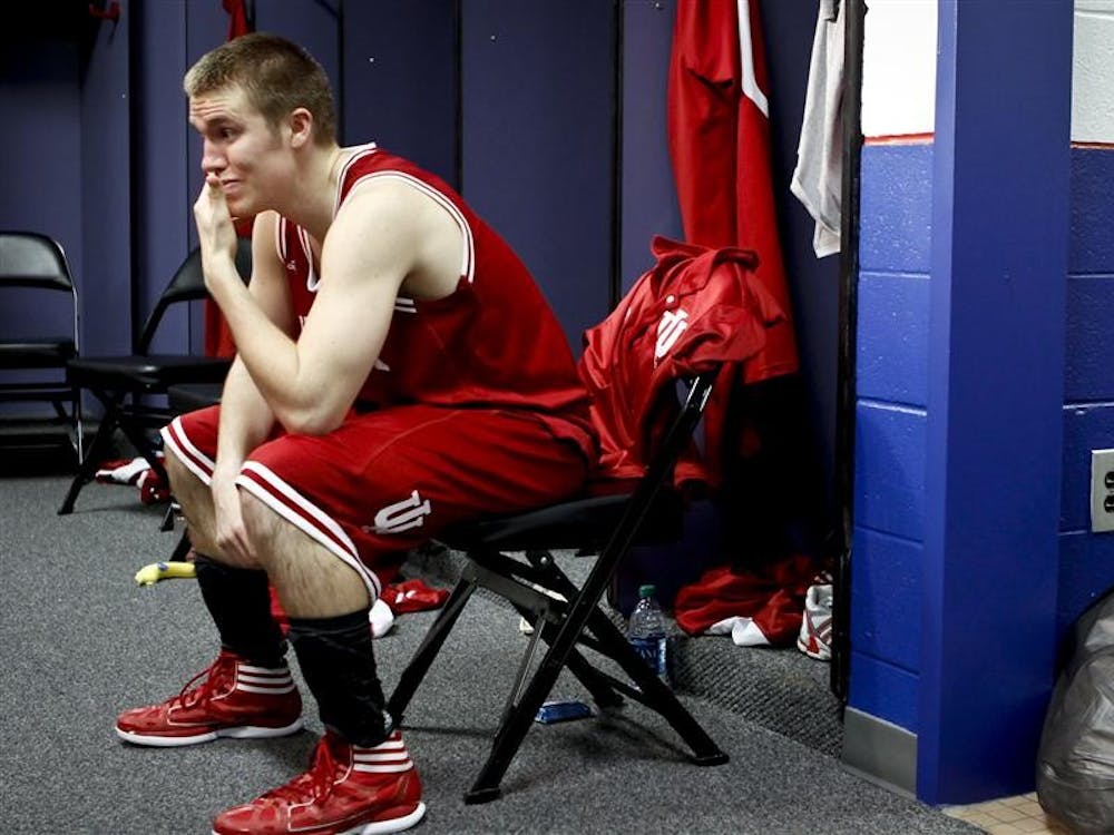 Jordan Hulls sits in the locker room following the Hoosiers' 90-102 loss to UK during the NCAA Tournament on Saturday at the Georgia Dome in Atlanta, Georgia.