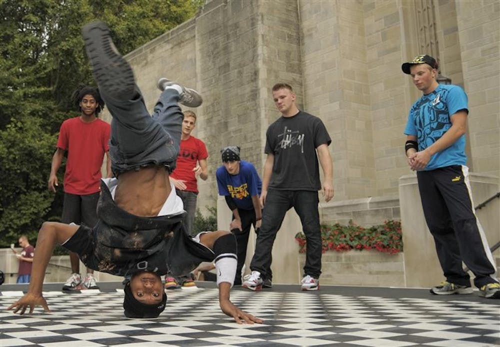 Members of the IU Breakdance Club perform at CultureFest on Thursday evening outside of the Lilly Library. Audience members clapped a beat for the dancers to perform to after sound equipment malfunctioned.