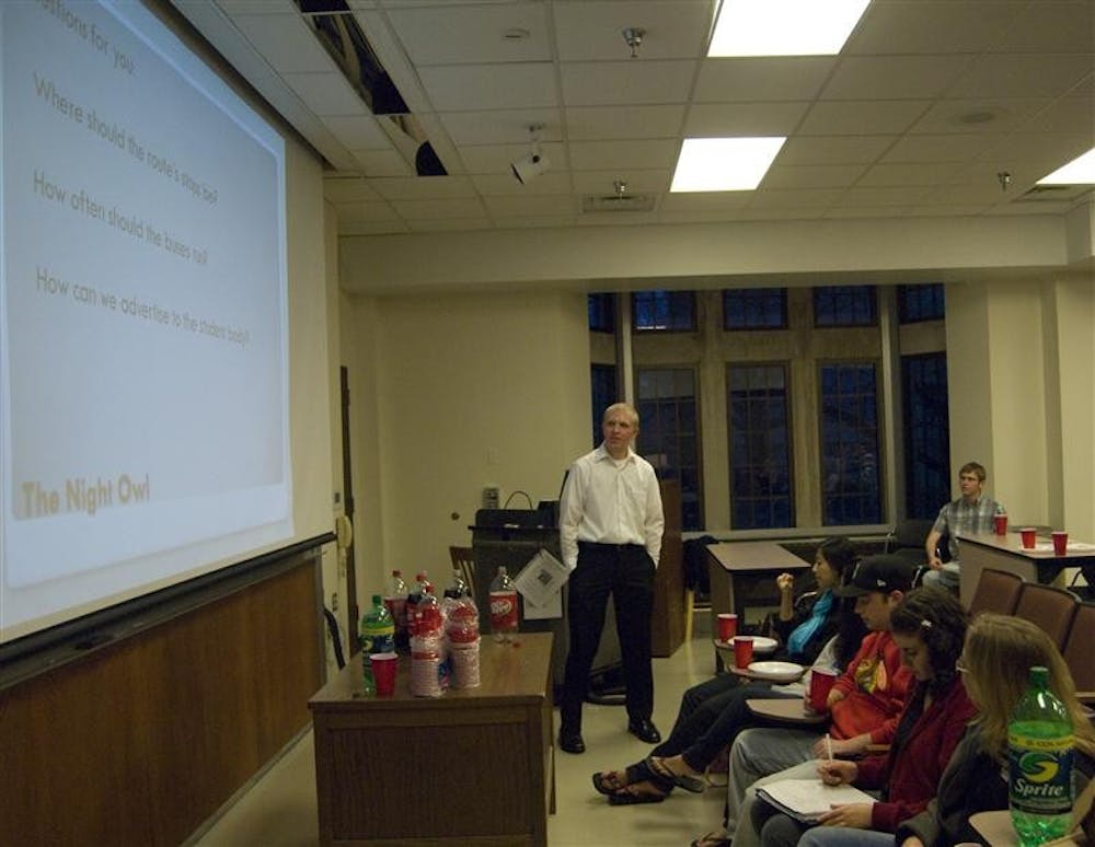 Senior Jonathan Rollins asks students for ideas about the Night Owl bus program Monday evening in Woodburn Hall. Supporters of the Night Owl program say buses should run until 4 a.m. on the weekends. 