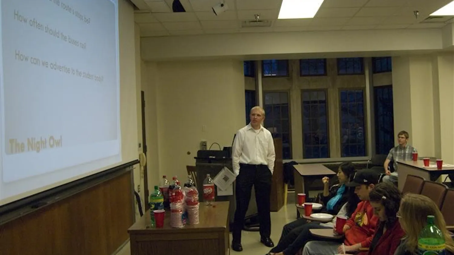 Senior Jonathan Rollins asks students for ideas about the Night Owl bus program Monday evening in Woodburn Hall. Supporters of the Night Owl program say buses should run until 4 a.m. on the weekends.