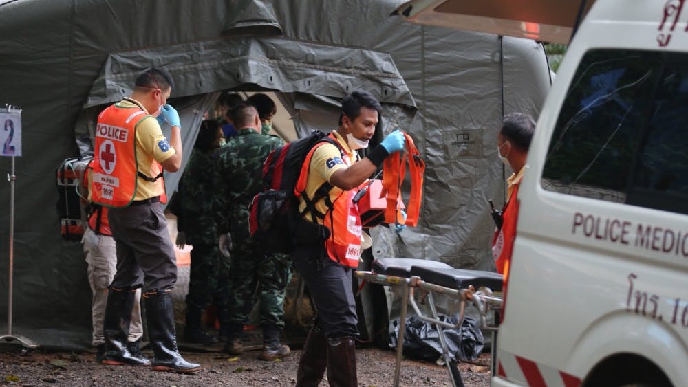 Rescuers work July 9, 2018, near the cave where 12 young soccer team members and their coach were trapped in Chiang Rai, Thailand.&nbsp;