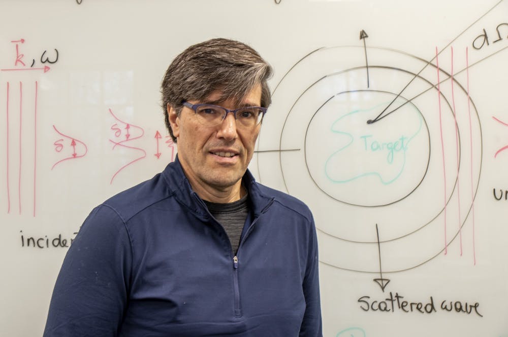 Gerardo Ortiz, an IU physics professor, stands in front of a board in his office Feb. 10 at Swain Hall West. Ortiz co-leads the new IU Quantum Science and Engineering Center with physics colleague David Baxter.