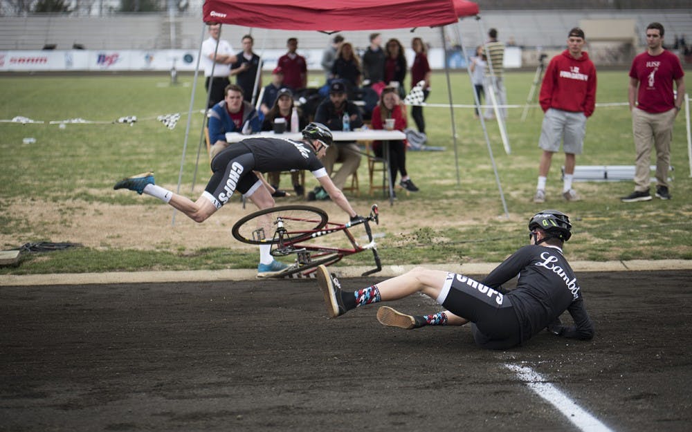 Riders from Lambada Chi Alpha fall during their first attempt to qualify for the Little 500 on Saturday. After attempting a second time, Lambada finished in seventh place with a time of 2:26.133. 