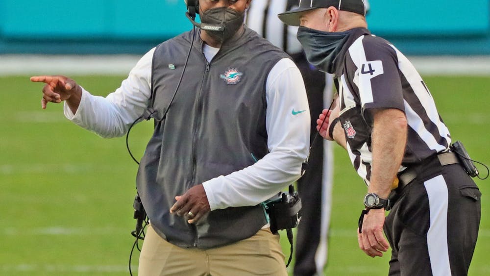 Miami Dolphins head coach Brian Flores talks with an official in the second half against the Kansas City Chiefs on Dec. 13, 2020, at Hard Rock Stadium in Miami Gardens, Florida.