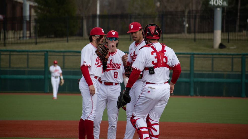 Infielders discuss on the mound February 21, 2023 against Miami (Ohio) at Bart Kaufman Field in Bloomington. Indiana ﻿went 1-2 against Texas over the weekend.