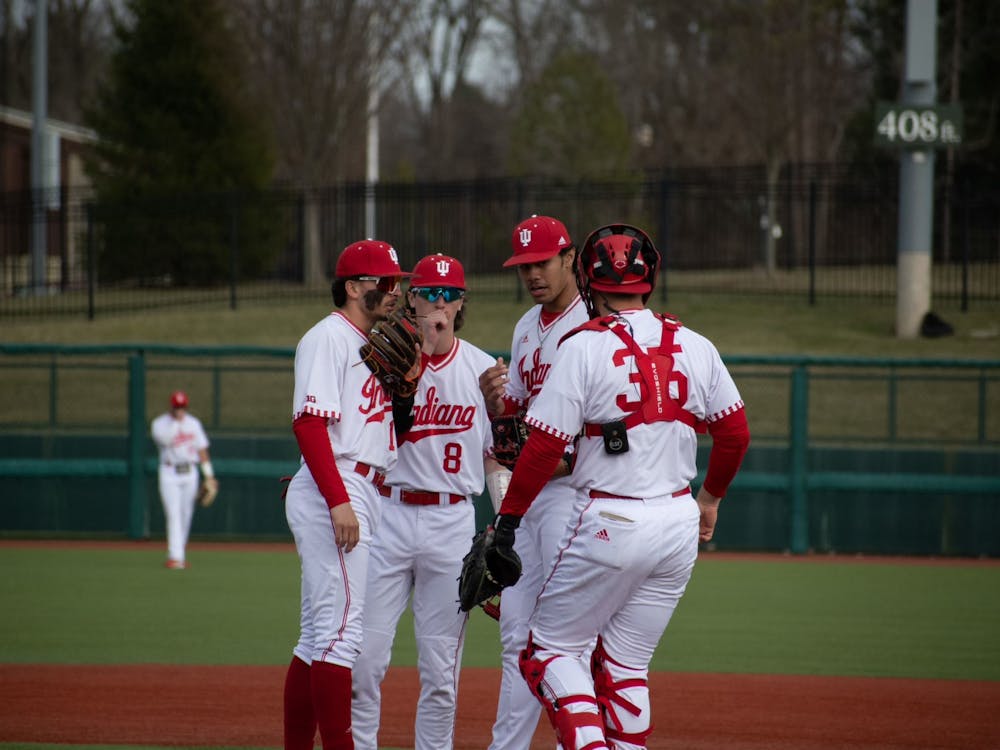 Infielders discuss on the mound February 21, 2023 against Miami (Ohio) at Bart Kaufman Field in Bloomington. Indiana ﻿went 1-2 against Texas over the weekend.
