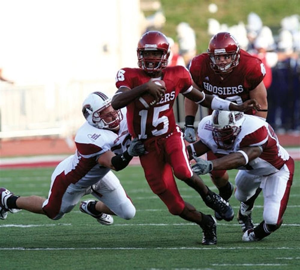 
IU quarterback Kellen Lewis tries to escape the grasp of two saluki defenders during a Sept. 16, 2006 game at Memorial Stadium.