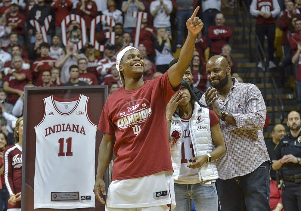 Senior guard Yogi Ferrell points to fans during senior night after Indiana's game against Maryland on Sunday at the Assembly Hall. 