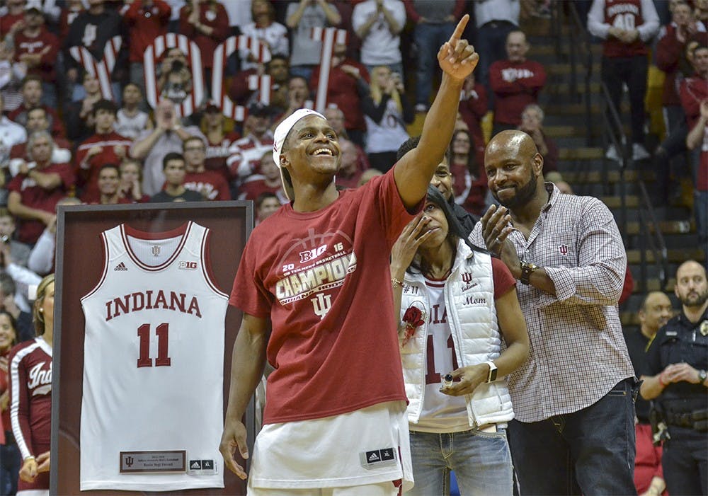 Senior guard Yogi Ferrell points to fans during senior night after Indiana's game against Maryland on Sunday at the Assembly Hall. 

