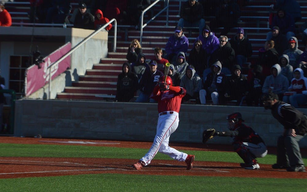 Sophomore infielder Luke Miller makes contact with the ball in a win over Cincinnati on Thursday evening. Miller has both pitched and played the field for IU this season.