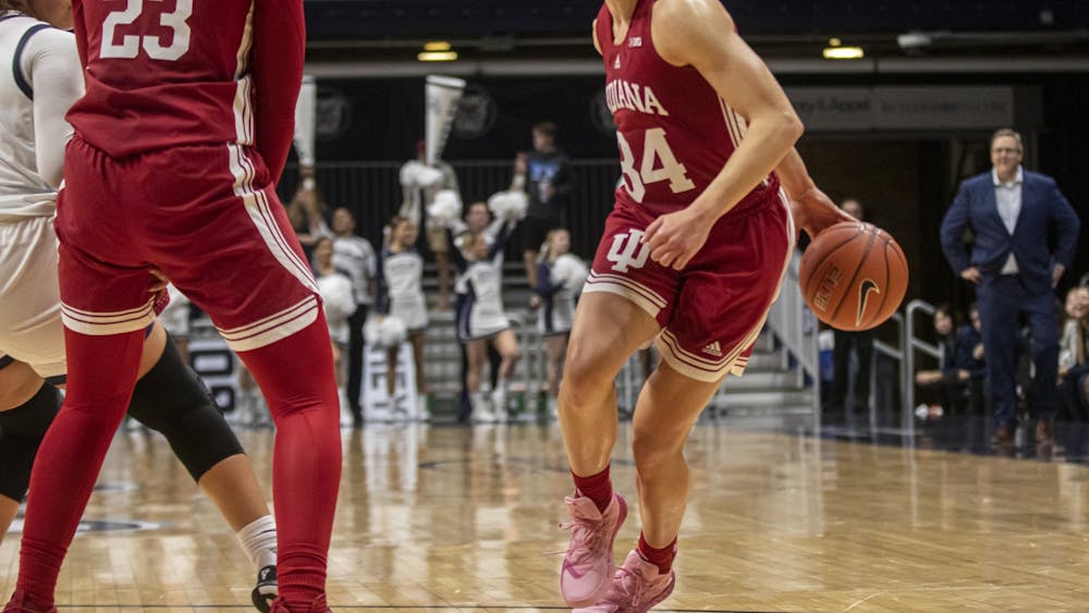 Indiana senior guard Grace Berger dribbles behind her back during the game against Butler University on Nov. 10, 2021, at Hinkle Fieldhouse. Berger scored 17 points in Indiana's win over Quinnipiac University on Saturday. 