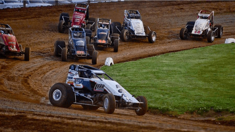 Sprint cars race around the track of Bloomington Speedway. Clauson Marshall Racing’s Emerson Axsom won his first-career Indiana Sprint Week feature Friday night at Bloomington Speedway in Bloomington, Indiana. 