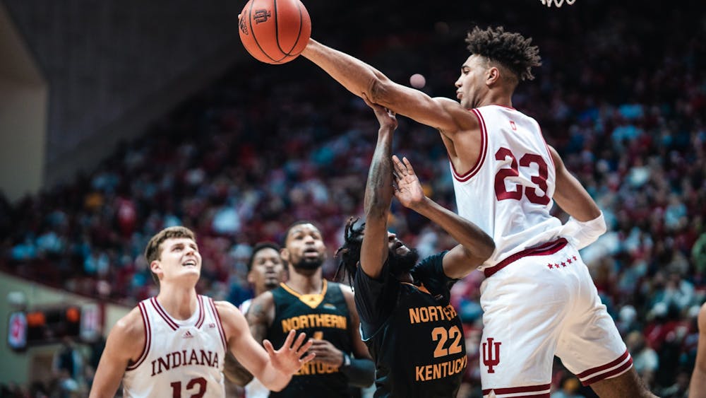 Junior forward Trayce Jackson-Davis blocks a shot from the opposing team Dec. 22, 2021, at Simon Skjodt Assembly Hall. Indiana defeated Northern Kentucky University 79-61.