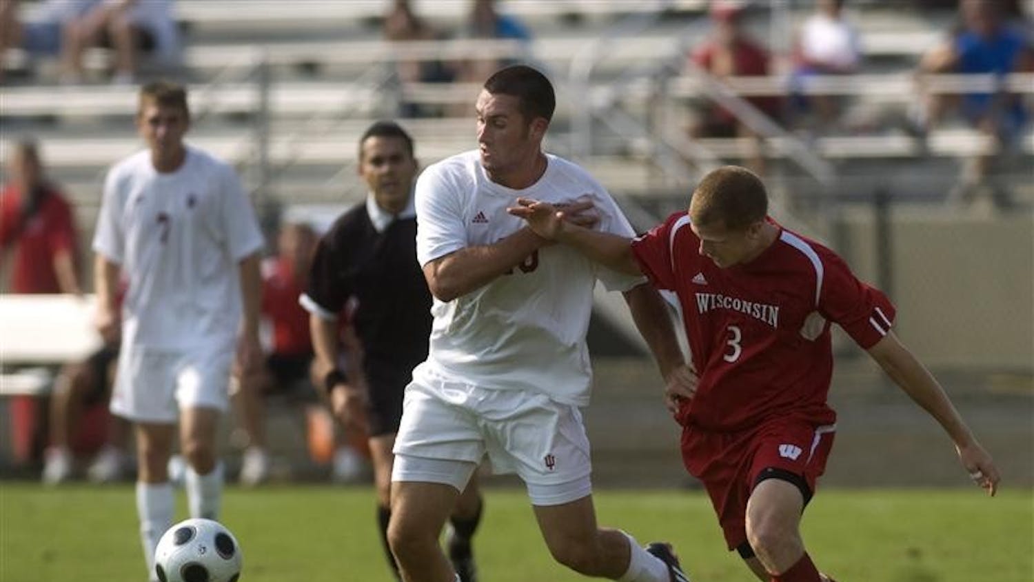Freshman forward Will Bruin dribbles past Wisconsin defender Zack Lambo during a 3-2 Hoosier victory on Sunday, Sept. 21 at Bill Armstrong Stadium.  Bruin scored 2 goals to help IU defeat Evansville 3-2 Tuesday night in Evansville.