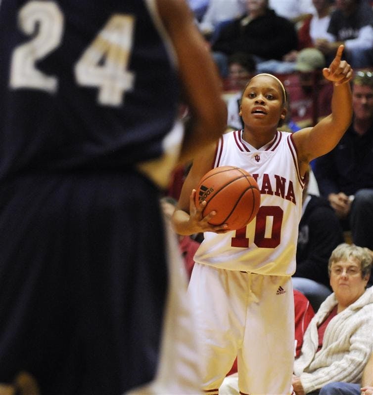 IU guard Andrea McGuirt directs the offense during IU's 63-41 win against Butler on Tuesday night at Assembly Hall. IU defeated West Virgina on Saturday, the team's sixth-straight victory. The Hoosiers will go for seven straight when they host Northwestern on Dec. 20.