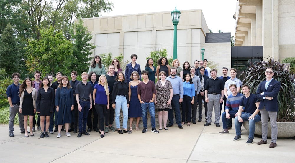 <p>Members of IU&#x27;s vocal ensemble group, NOTUS, are seen March 29, 2023, standing outside IU Jacobs School of Music for a group photo. NOTUS is the only university-based group in the United States that exclusively studies and performs choral arrangements written after 1900.</p>