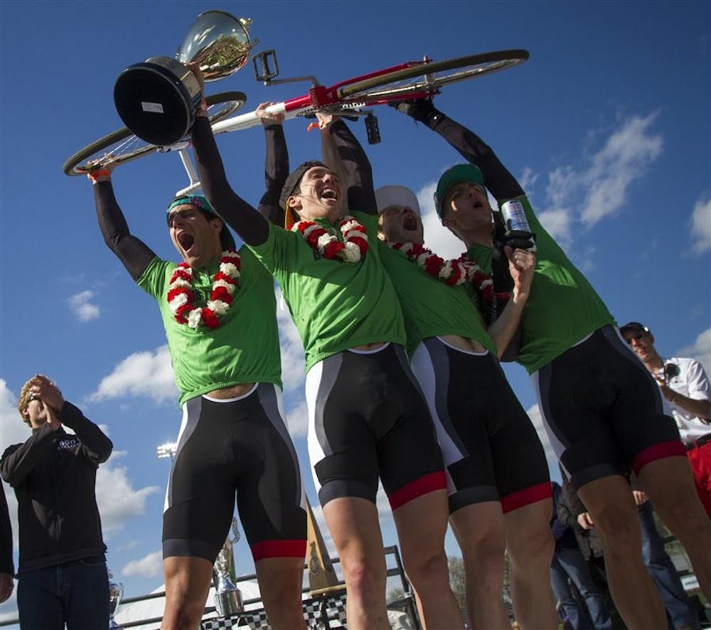 Beta Theta Pi riders celebrate after winning the Men's Little 500 race at Bill Armstrong Stadium.