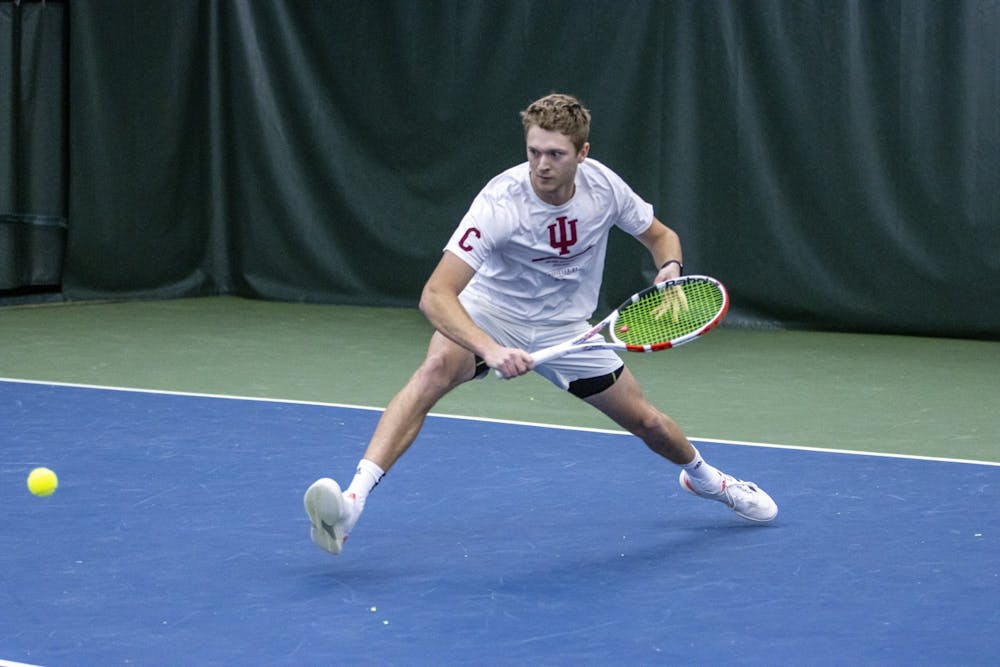 <p>Senior Carson Haskins attempts to return a serve against Princeton on Feb. 6, 2022, at the IU Tennis Center. Indiana lost 4-0 to No. 2 Ohio State and 4-3 to Penn State at home over the weekend.</p>