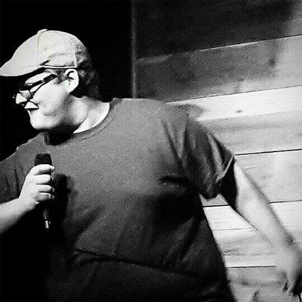 Logan Hendry, the host of Laugh 'Til It Berns, performing a standup comedy set. Hendry moved to Bloomington in January to pursue his comedy career.