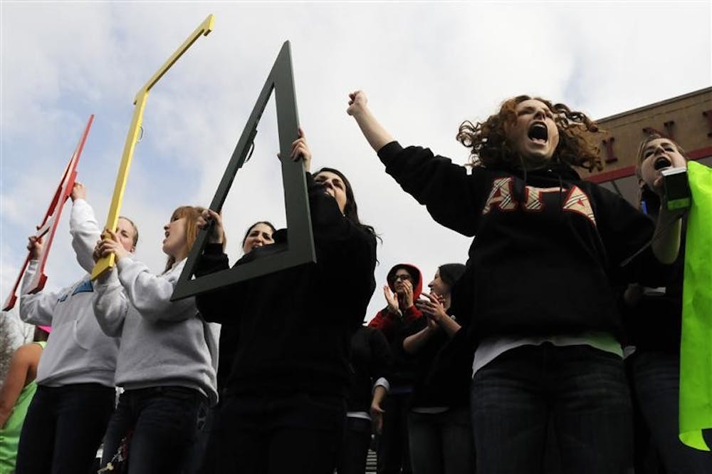 Alpha Gamma Delta fans cheer their team on during Little 500 Qualifications on Saturday at Bill Armstrong Stadium. The team will roll off the grid from the ninth starting position on race day.