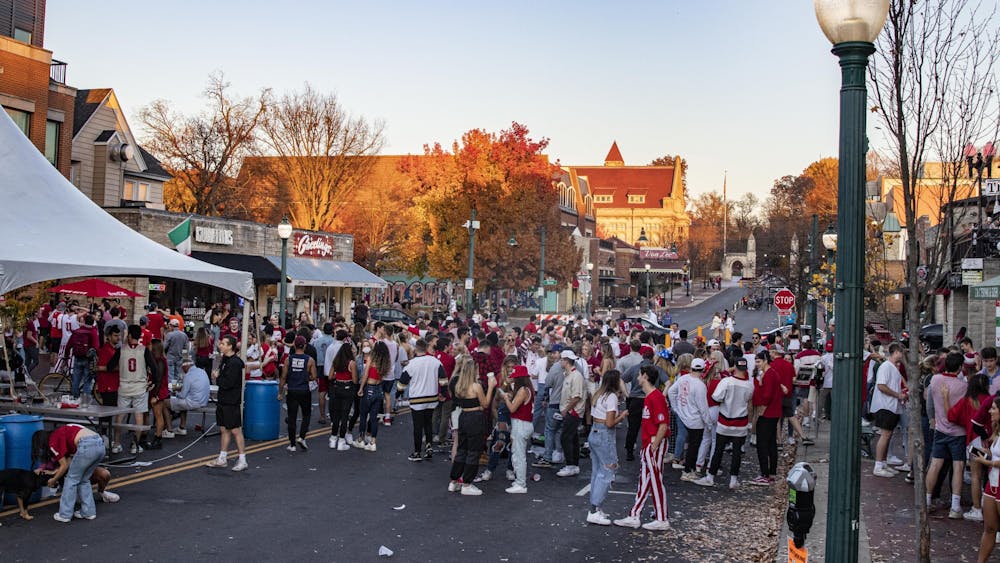 IU students join together in celebration Nov. 7 on Kirkwood Avenue in Bloomington. IU defeated Michigan earlier that day, 38-21.