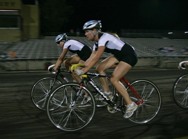 Juniors Jennifer Balbach and Jenna Cerone round turn four during Team Pursuit on Saturday evening at Bill Armstrong Stadium. Kappa Delta went on the final heat of the women's race and won the event over Kappa Alpha Theta.