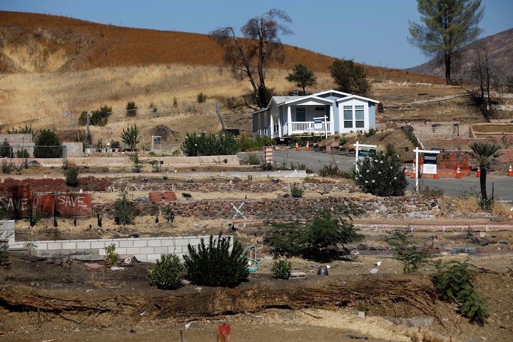 The mobile home of Richard Lohmann, a resident of 20 years, sits next to vacant lots of burned out homes Oct. 29 at Seminole Springs Mobile Home Park in Agoura Hills, California. Roughly half of the Seminole Springs Mobile Home Park was destroyed by the Woolsey fire last year, leaving more than one hundred families homeless.