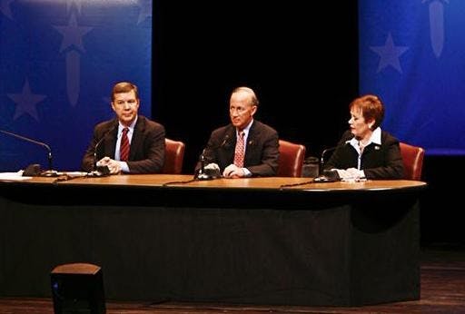 Moderator Tom Cochrun, and gubernatorial candidates Andy Horning, Mitch Daniels and Jill Long Thompson talk Tuesday evening at the IU Auditorium.