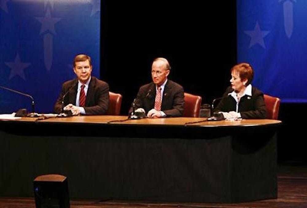 Moderator Tom Cochrun, and gubernatorial candidates Andy Horning, Mitch Daniels and Jill Long Thompson talk Tuesday evening at the IU Auditorium.