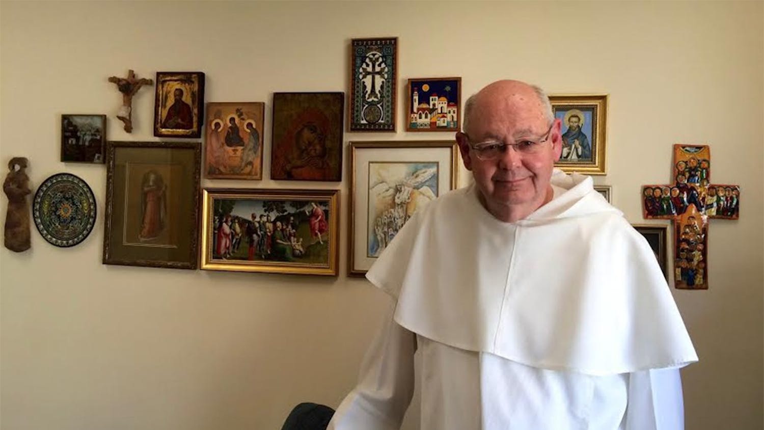 Father John Meany in his office at St. Paul Catholic Center. In the four days since the Pope released his newest document, the pastor has tried to discern what messages to take away. 