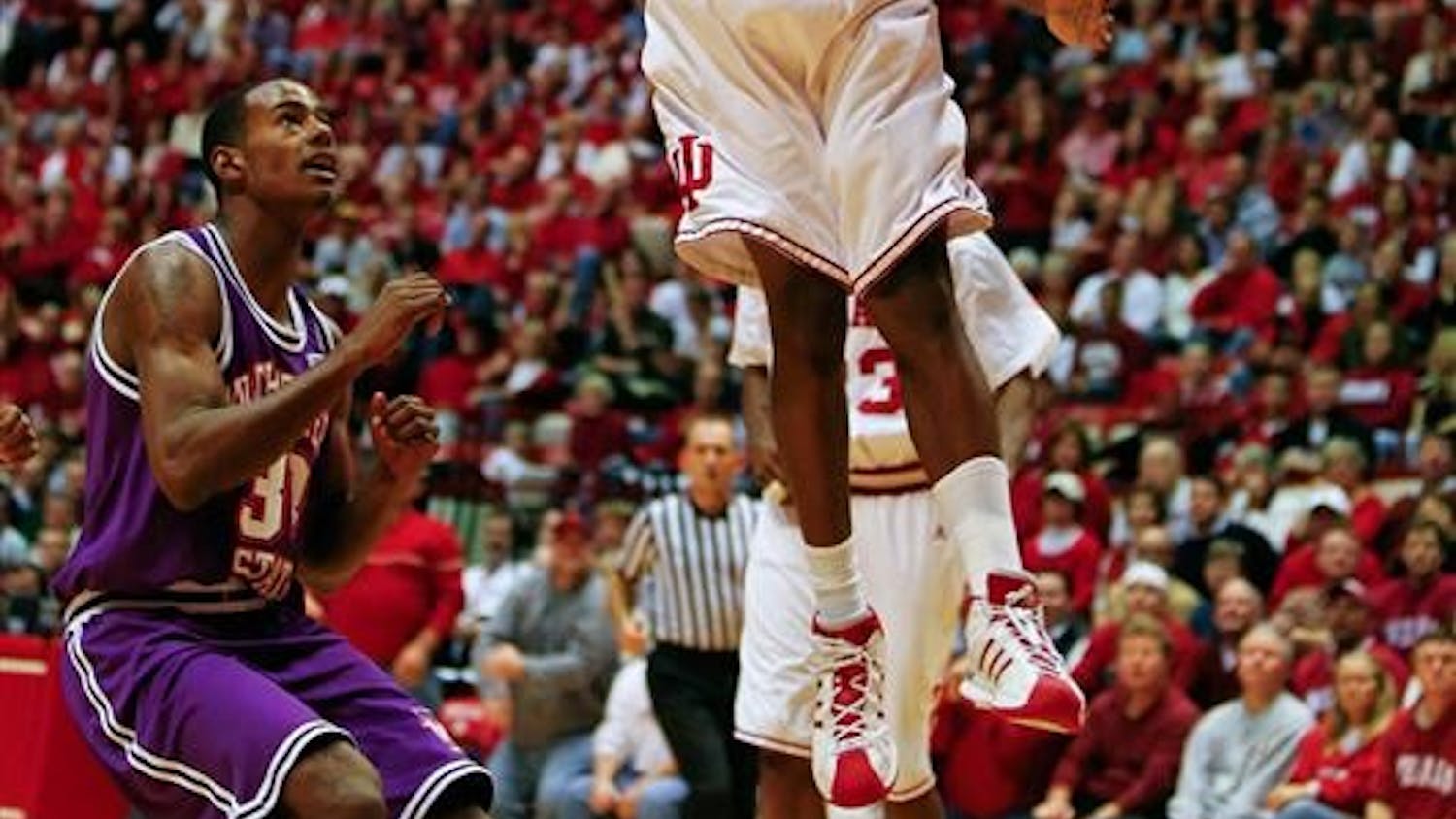 Freshman guard Malik Story dunks over a Northwestern defender during the Hoosiers 83-65 win over Northwestern State Nov. 15, 2008 at Assembly Hall.