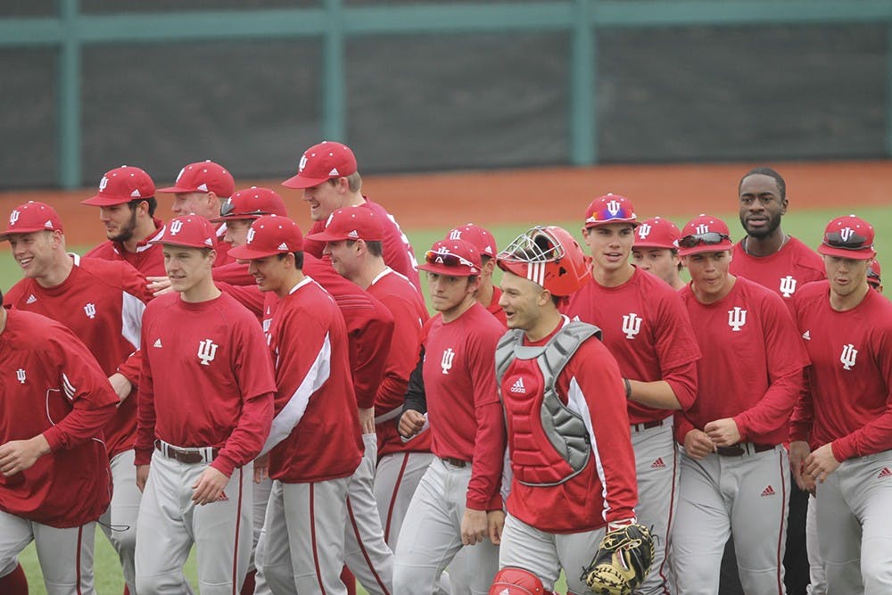 Members of the baseball team walk off the field after warmups at practice on Wednesday at Bart Kaufman Stadium. IU's first game of the season is at Stanford on Friday.