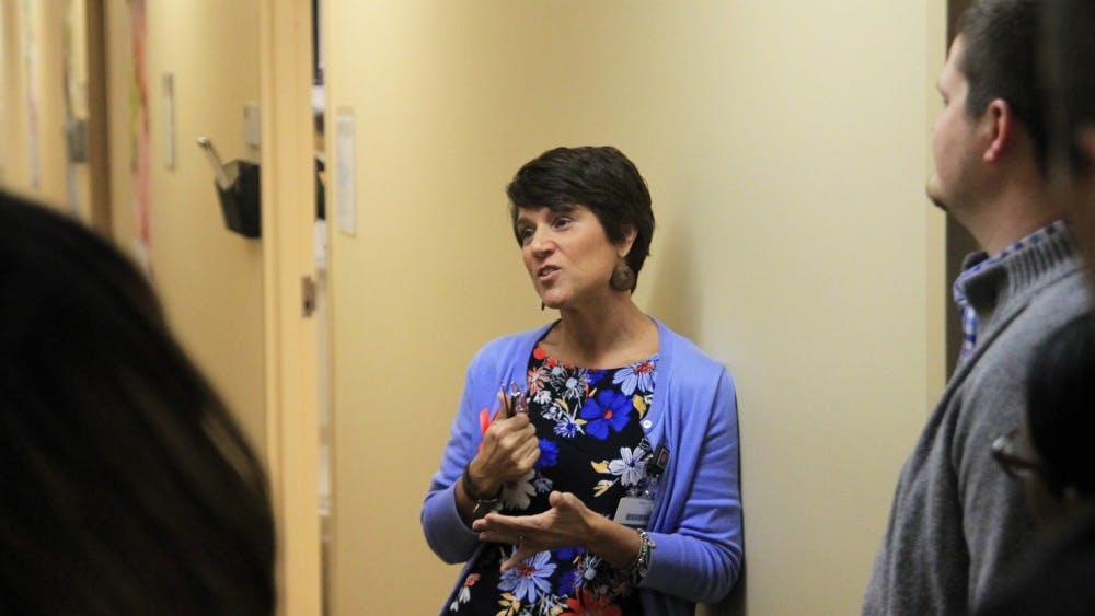 Julie Hiles, a care coordinator at Positive Link, speaks with people on a tour of the facilities. Positive Link HIV Services new clinic will provide direct care to those who are HIV positive.&nbsp;