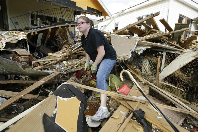 Gina Hadley sifts through her destroyed home in the aftermath of Hurricane Ike on Wednesday in Galveston, Texas. Residents were allowed to return to the island Wednesday.