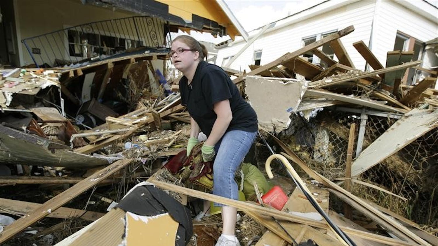 Gina Hadley sifts through her destroyed home in the aftermath of Hurricane Ike on Wednesday in Galveston, Texas. Residents were allowed to return to the island Wednesday.