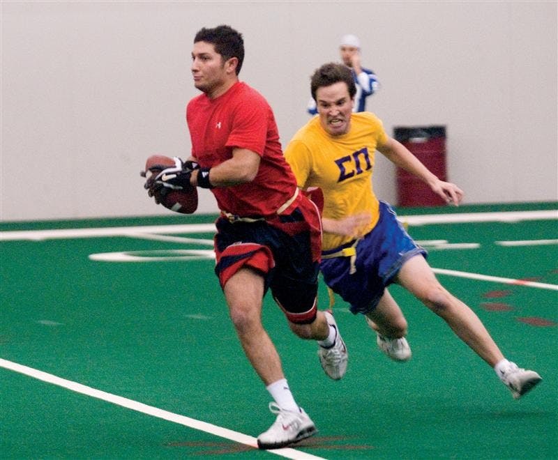 Two men play flag football at the Intramural Flag Football Championships on Nov. 12, 2006, at Mellencamp Pavillion. 