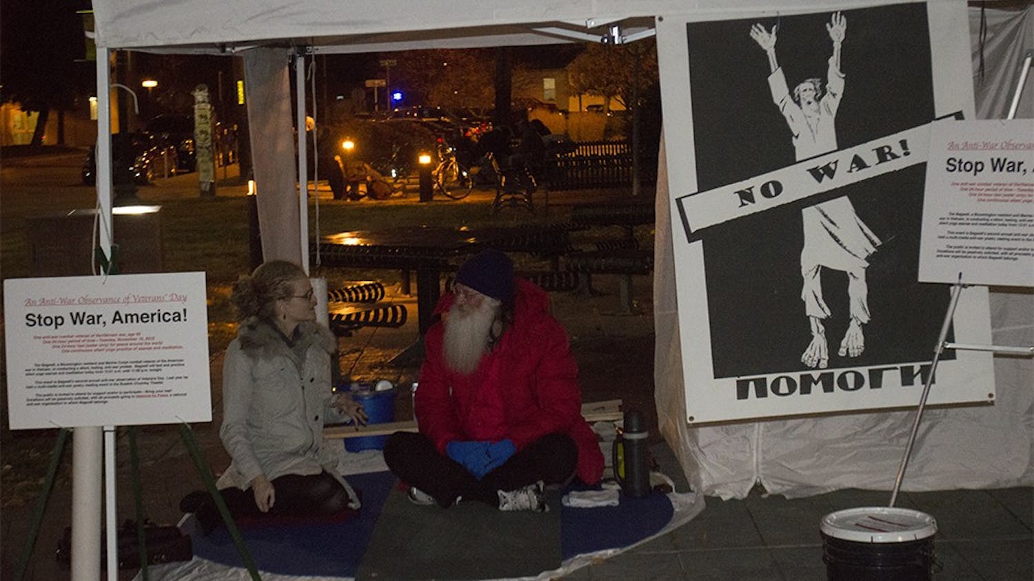 Tim Bagwell, an anti-war activist and Vietnam War veteran, spoke with Emily Tally on Tuesday night at Peoples Park. Bagwell protested the day before Veteran's Day, but he said he was leaving the day itself for those who worship flags, nationalism and killing.