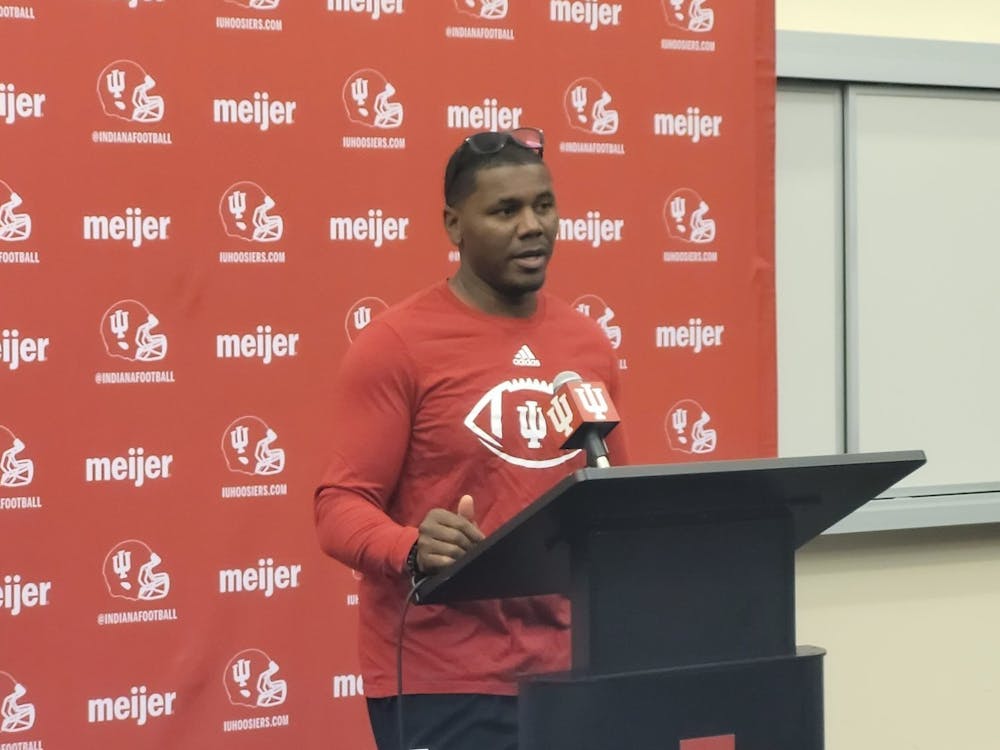 IU football associate head coach and running backs coach Deland McCullough speaks to the media Friday. McCullough said he is encouraged by the team's walk-on running backs at the press conference.