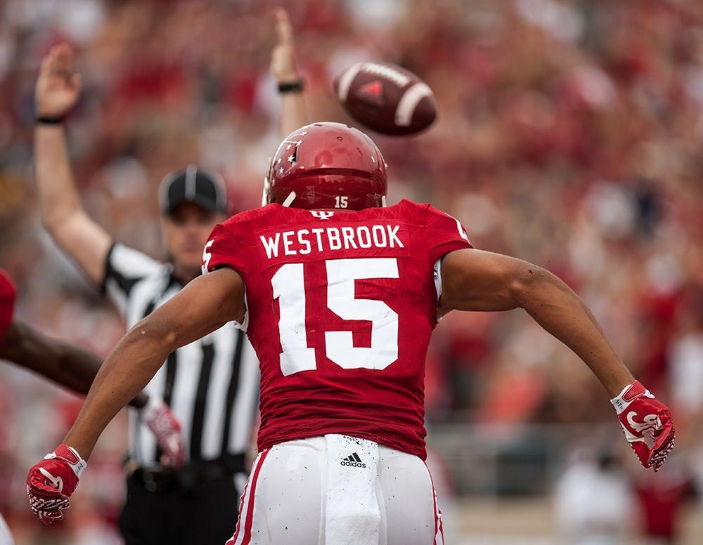 Sophomore wide receiver Nick Westbrook celebrates after scoring the Hoosiers first touchdown against Ball State on Saturday at Memorial Stadium.